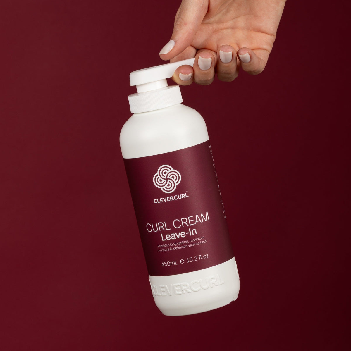Two people with long curly hair holding Clever Curl Curl Cream Leave-In 450ml